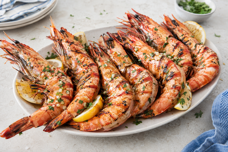Large grilled prawns with garlic butter, lemon, and parsley