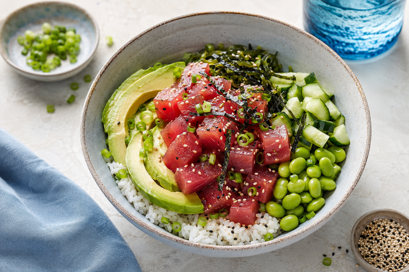 Ahi tuna poke bowl with rice, avocado, cucumber, edamame, and sesame