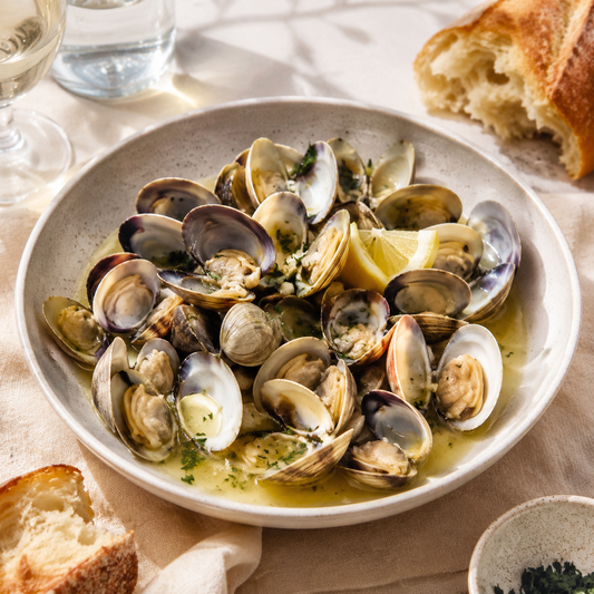 Steamed whole-shell baby clams with garlic, white wine and parsley
